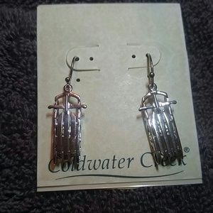 Sterling Silver sled ear jewelry.